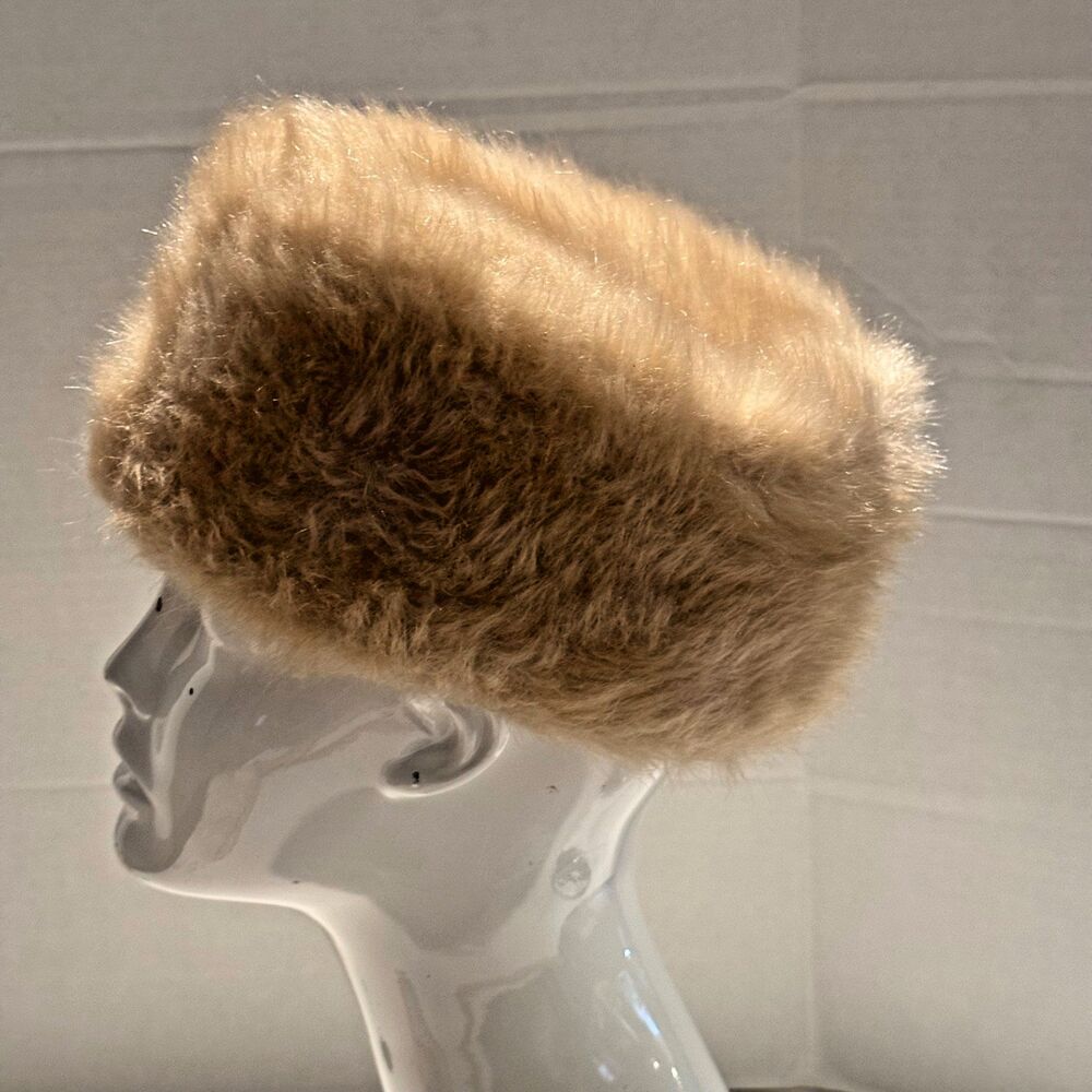 Vintage blonde mink pillbox hat with a soft, fluffy texture in a warm honey-tan